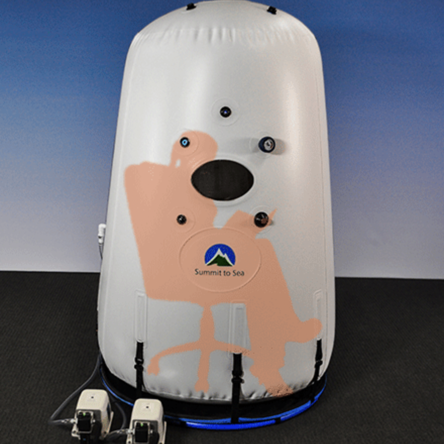 our Mild Hyperbaric Oxygen Therapy with person sitting inside .